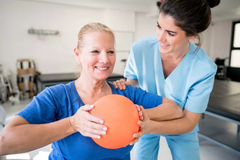 Women Doing Physical Therapy with Female Therapist