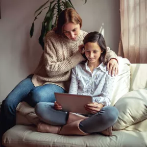 Teen Girl with Mom Filling Out Form