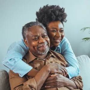A Daughter Hugs Her Senior Father