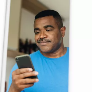 Man reading iPhone 