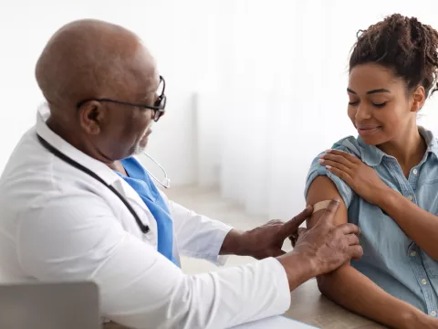 A Doctor Put on a Bandage After Giving an Injection