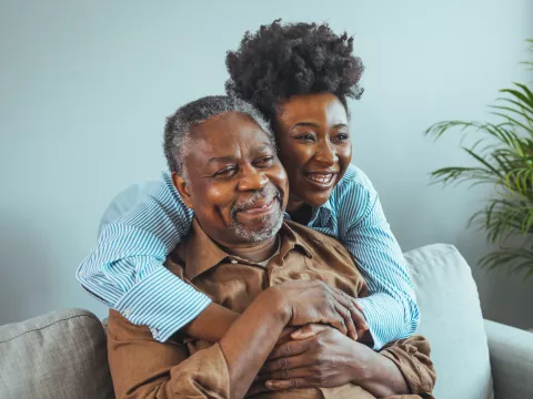 A Daughter Hugs Her Senior Father