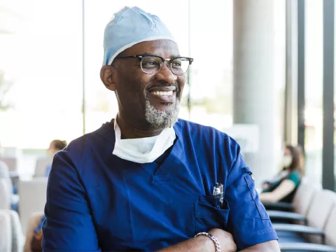 A Doctor Smiles as He Reflects on a Job Well Done.