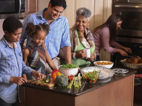 Family cooking meal in the kitchen for holiday