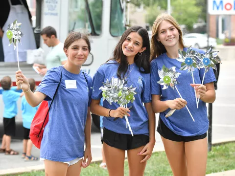 Three teen girls at junior board event