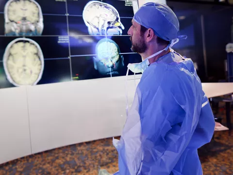 Physician looking at brain scans