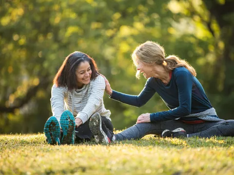Women Stretching in Park
