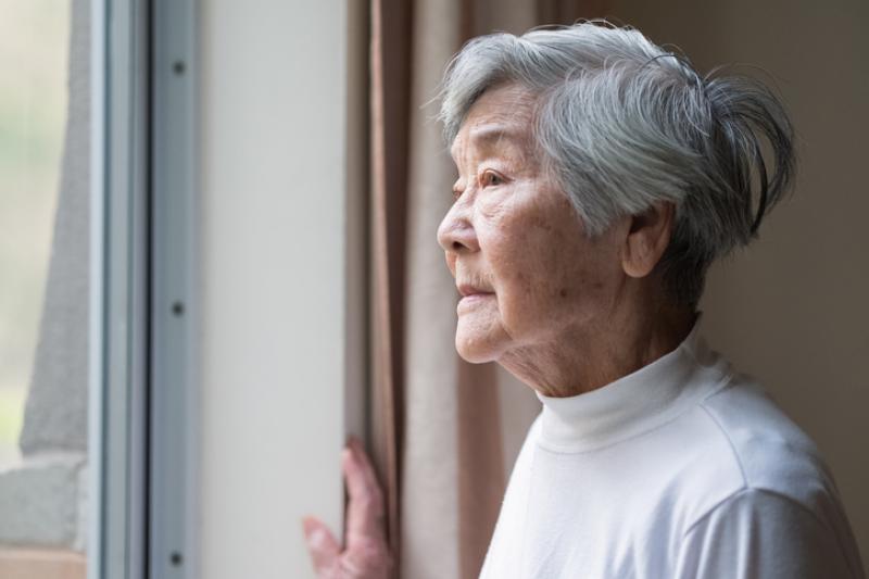 Alzheimers Patient looking out a Window