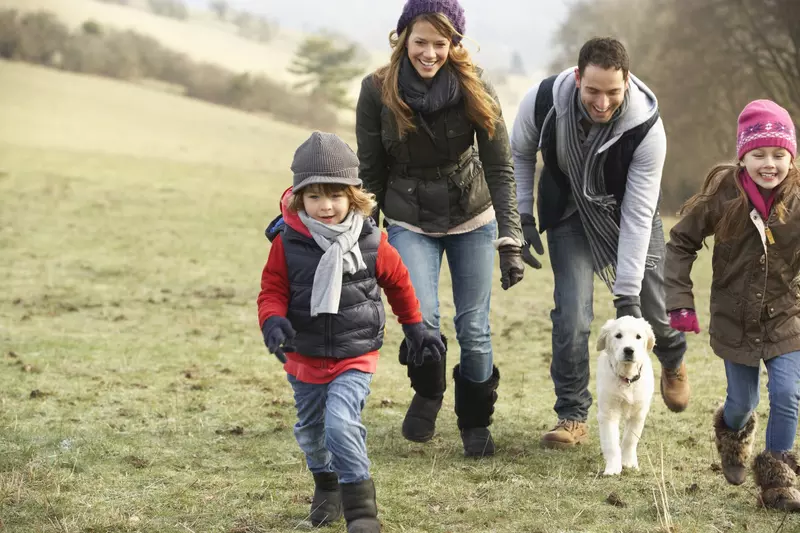 A family goes on a hike together.