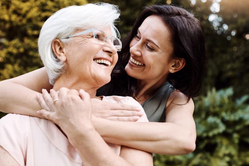 Woman Hugging Older Mother