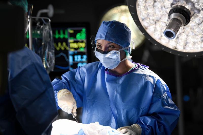 Female Surgeon Performing Surgery