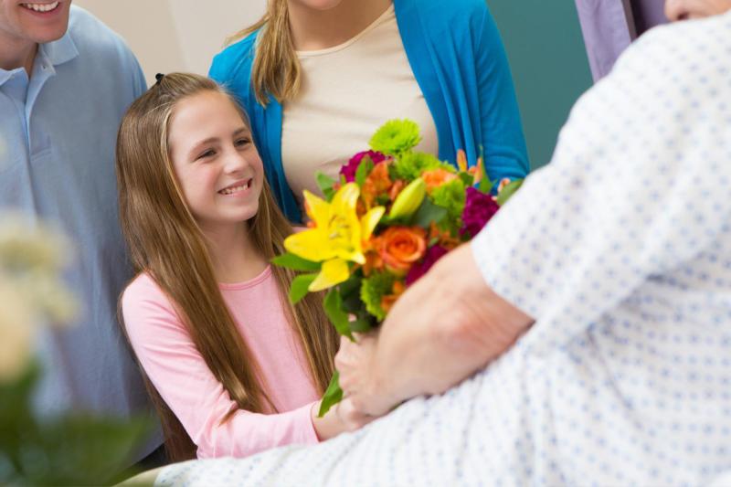 A Girl and Her Family Visiting a Family Member in the Hospital