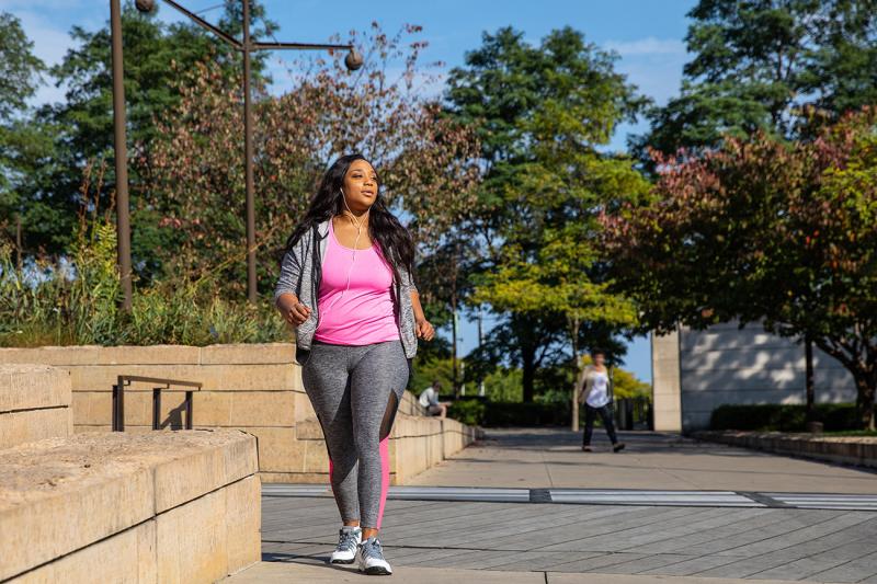 Woman Walking Outdoors in Chicago Area