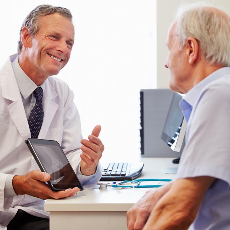 Doctor Showing Patient Imaging Results