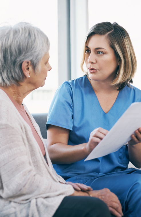 A Physician Goes Over a Chart with a Senior Patient.