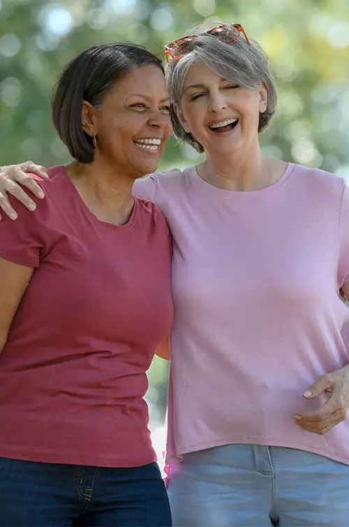 Two women jogging in park